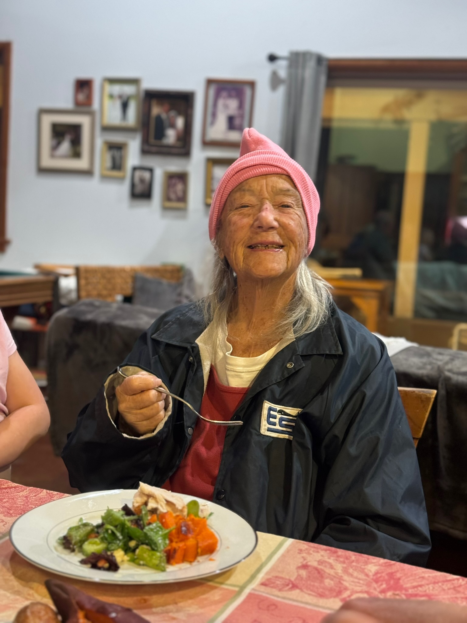 Sue A. Duffy, pink beanie, mid-grin