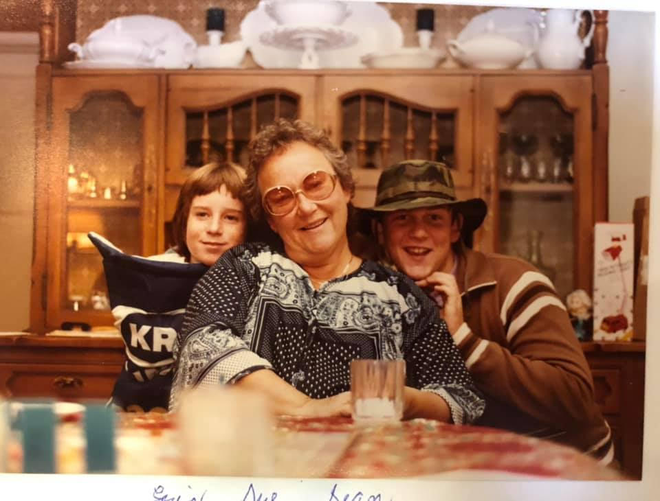 Sue at the family table with two of the kids